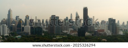 Beautiful sunset cityscape and high-rise buildings in metropolis city center . Downtown business district in panoramic view .