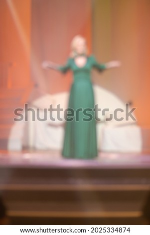Blur texture background for design. Artists perform on stage in light and smoke