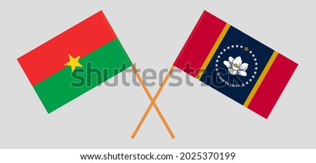 Crossed flags of Burkina Faso and the State of Mississippi. Official colors. Correct proportion