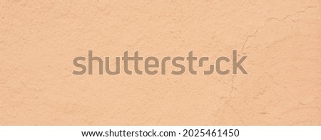 Blurred picture texture of clay house structure. Wall of soil house. Mud background