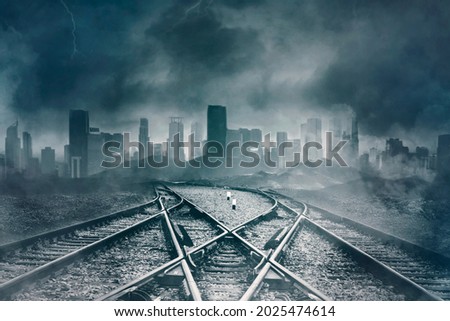 Image of empty railroads with gloomy cityscape background. Concept of Halloween horror
