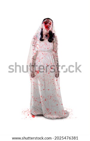 Halloween horror concept. Full length of terrifying female ghost wearing bride gown while standing in the studio. Isolated on white background