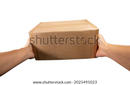 Point of view hand of courier holds the package or Parcel box delivery to the customer isolated on white Royalty-Free Stock Photo #2025495023
