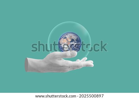 Digital collage modern art. Hand holding globe with bubble. element of this image are furnished by NASA Royalty-Free Stock Photo #2025500897