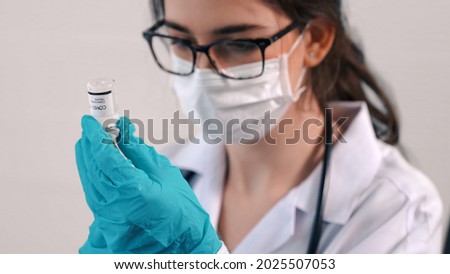 Skillful doctor prepare vaccine proficiently before injection . Covid 19 and coronavirus vaccination center service concept .