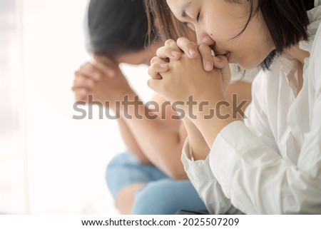 Christian small group praying together in homeroom, devotional or prayer meeting concept Royalty-Free Stock Photo #2025507209