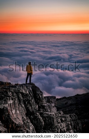 Watching sunset over the clouds in Kneyse Mountain located in Mount Lebanon   Royalty-Free Stock Photo #2025522650
