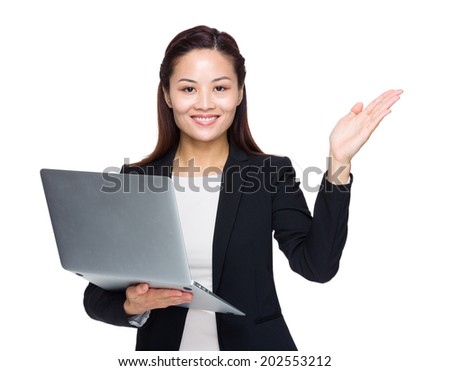 Business woman with laptop computer and hand presentation