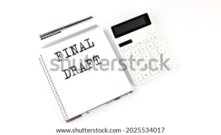 Notepad with text FINAL DRAFT with calculator and pen. White background. Business concept