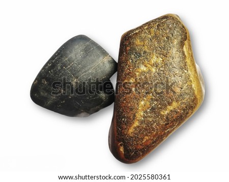 close up of sea, river rocks stones backdrop. Sea pebble, pebbles  stone isolated on white background.brown and black Stone. Selective focus