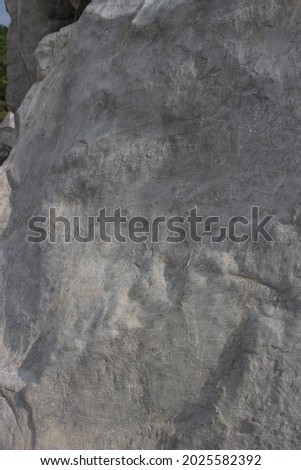 background. texture of a white stone by a large stone