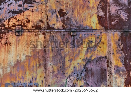 Metal construction with rust, cracks, corrosion, orange and yellow masking paint. Rusty grunge surface, overlay for site and photo manipulation