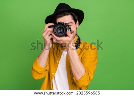 Photo of young handsome professional photographer take picture you camera isolated on green color background Royalty-Free Stock Photo #2025596585