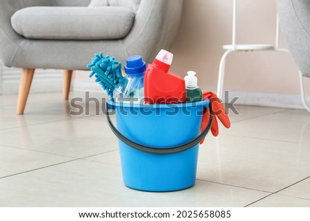 Set of cleaning supplies in room