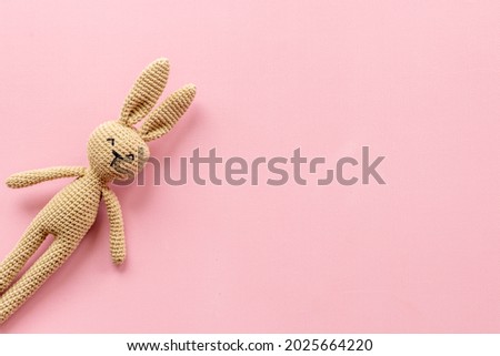 Knitted toy easter bunny for newborn baby or baby shower