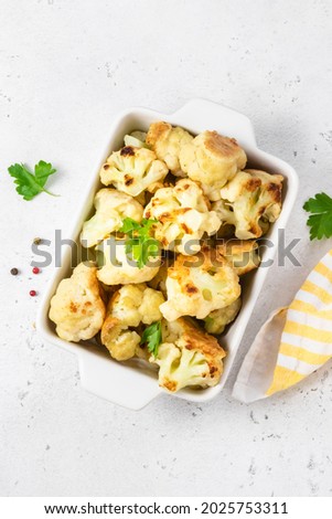 Spicy cauliflower wings in baking dish. Space for text, top view. Royalty-Free Stock Photo #2025753311