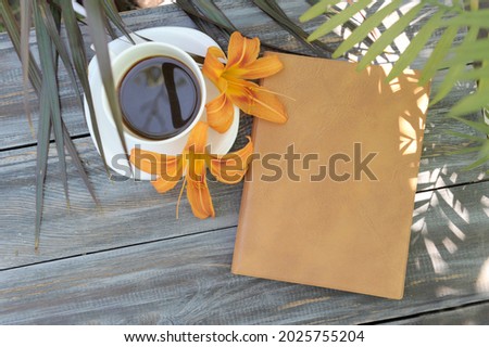 Morning mock up with coffee and notebooks on a wooden table, flat lay, outdoor summer photo with palm shadows