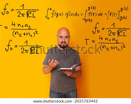 Teacher's day, Geography teacher. Lesson at school. Business plan . A man in his hands with a globe on a yellow background thinks about the planet by studying examples