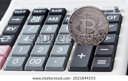 Bitcoin digital financial symbols on the calculator