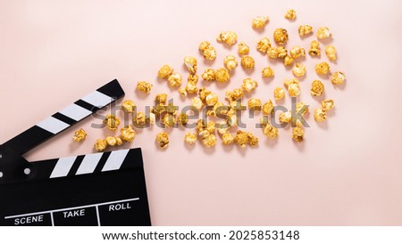 popcorn and clapperboard. Cinema background.Top view with copy space. Flat lay