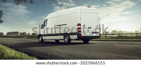 delivery van transported on a road  Royalty-Free Stock Photo #2025866555