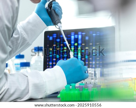 Scientist pipetting sample into a vial for DNA testing Royalty-Free Stock Photo #2025910556