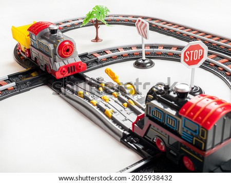 Railway for children to play, locomotives on a motor with batteries, railway tracks, signs, playing with trains