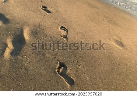 Human footprints on the sandy beach in Spain