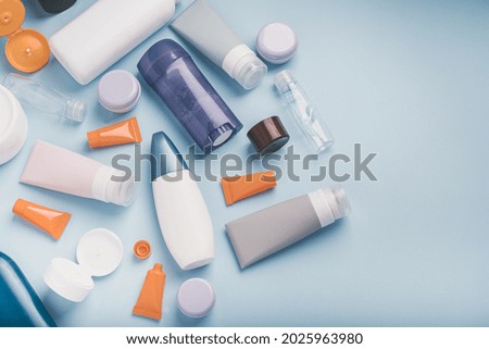 Cosmetic products for recycling. Polyethylene recyclable cosmetics package on blue background. Plastic garbage. Save the planet. High quality photo Royalty-Free Stock Photo #2025963980