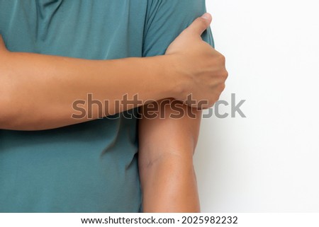 Holding arm man with pain in muscles and joints,Symptoms of peripheral neuropathy and numbness in muscles and ligament,Diseases caused by side effects of vaccination,Guillain Barre Syndrome(GBS) 