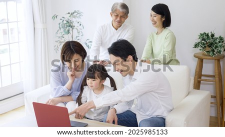 Asian family relaxing at home