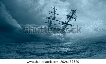 An old sailing ship in the mist sails towards the rocks - Sailing old ship in a storm sea in the background stormy clouds Royalty-Free Stock Photo #2026137590