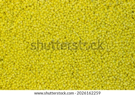 yellow granules of polypropylene or polyamide. background. Plastics and polymers industry. Copy space. Royalty-Free Stock Photo #2026162259