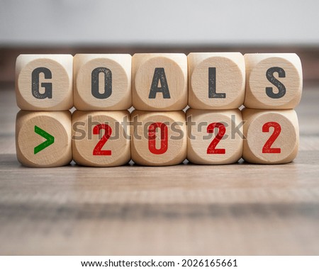 Cubes, dice or blocks with goals 2022 on wooden background