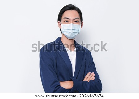 Health, Business Concepts., young businessman in blue suit wearing face 