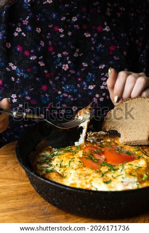 Healthy breakfast food, Stuffed egg omelette with vegetable, dark wooden background copy space top view