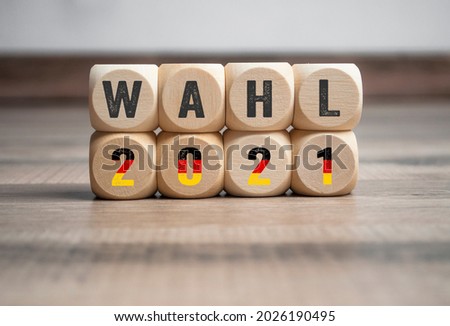 Cubes, dice or blocks with the german words for federal election 2021 - bundestagswahl 2021 with a red cross Royalty-Free Stock Photo #2026190495