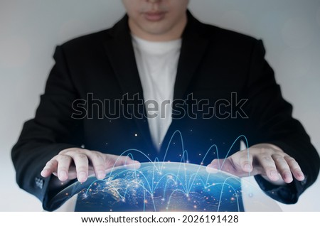 Concept of wireless network connection with future digital technology with night world background. Businessmen lay their hands on the virtual world. Elements of this image furnished by NASA