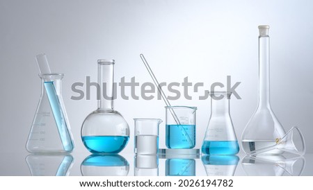 Scientist working with chemical reaction in chemistry laboratory. close up of scientist making research in lab in white background Royalty-Free Stock Photo #2026194782