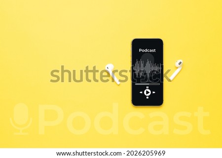 Podcast audio equipment. Audio microphone, sound headphones, podcast application on mobile smartphone screen. Recording sound voice on yellow background. Live online radio player mockup banner