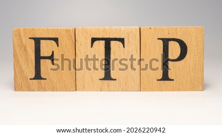 FTP was created from wooden cubes. News and journalism concepts. close up.