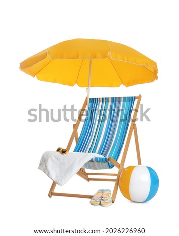 Open yellow beach umbrella, deck chair, inflatable ball and accessories on white background Royalty-Free Stock Photo #2026226960