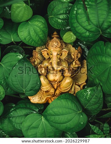 Ganesh Chaturthi Idol in Pepper Leaves Royalty-Free Stock Photo #2026229987