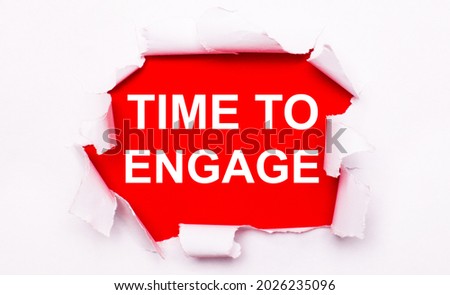 Torn white paper lies on a red background. On red, the text is white TIME TO ENGAGE