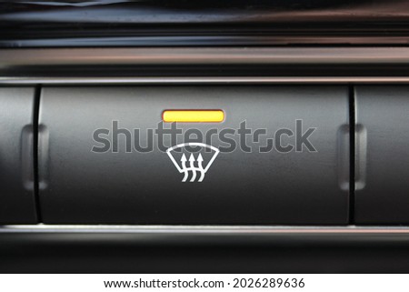 Front windscreen demister button in a new vehicle
