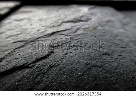Rough textured slate plated wall