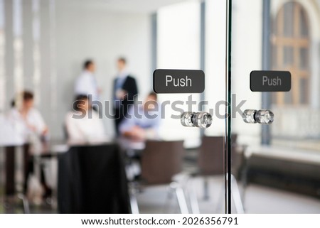 Office conference room glass door with push sign