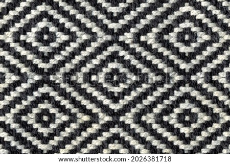 Rhombus - old ethnic canvas. Geometric ethnic pattern made with straw in black and white. knitting fabric pattern for background. Royalty-Free Stock Photo #2026381718