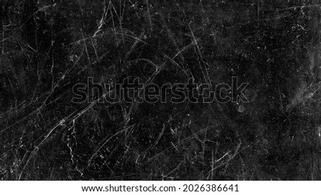 White scratches and dust on black background. Vintage scratched grunge plastic broken screen texture. Scratched glass surface wallpaper. Space for text. Royalty-Free Stock Photo #2026386641