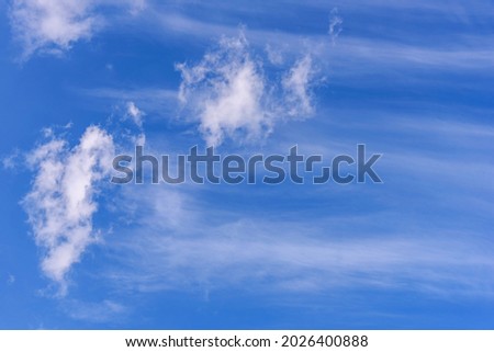 Beautiful motions white clouds on blue sky background. Puffy fluffy white clouds blue sky.